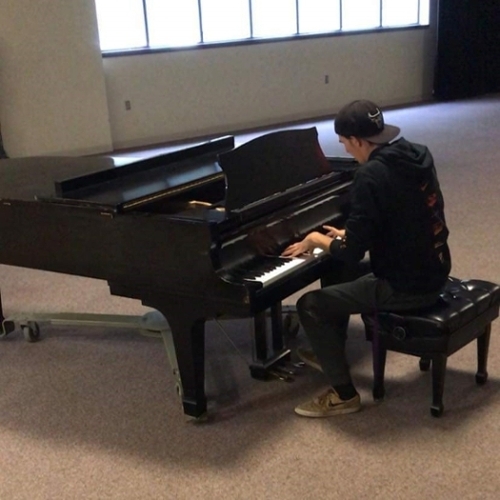 Ethan Hamlin practicing piano.